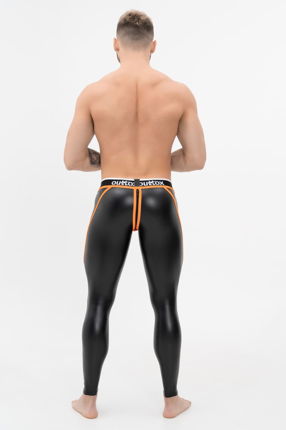 Outtox. Leggings mit Reißverschluss hinten und Druckknopf-Codpiece. Schwarz+Orange