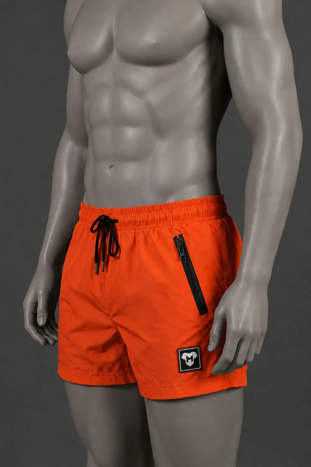 Jedd Synther Weiche Shorts mit Reißverschlusstaschen. Orange