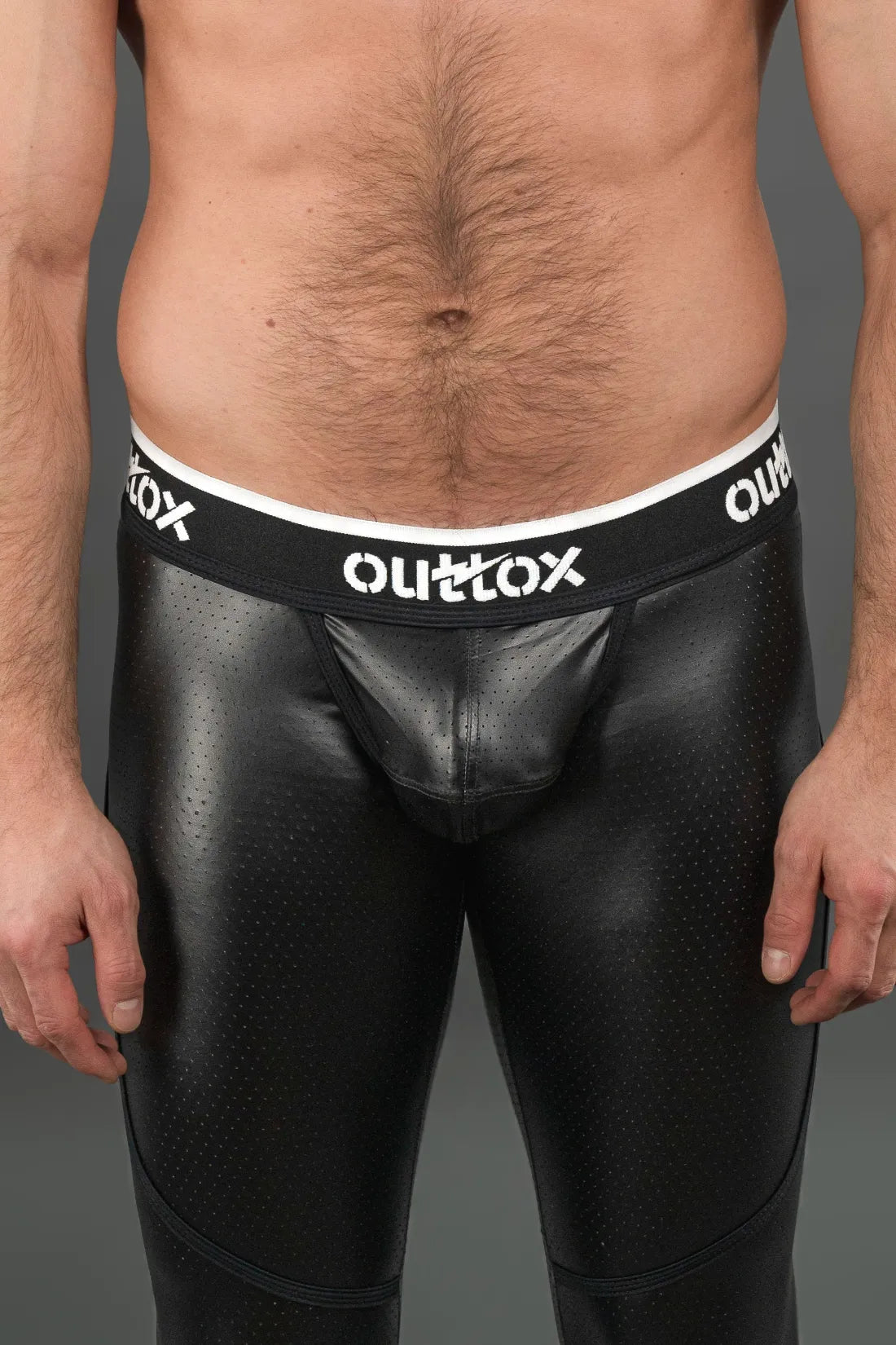 Outtox. Leggings arrière zippés avec pièce à pression. Noir