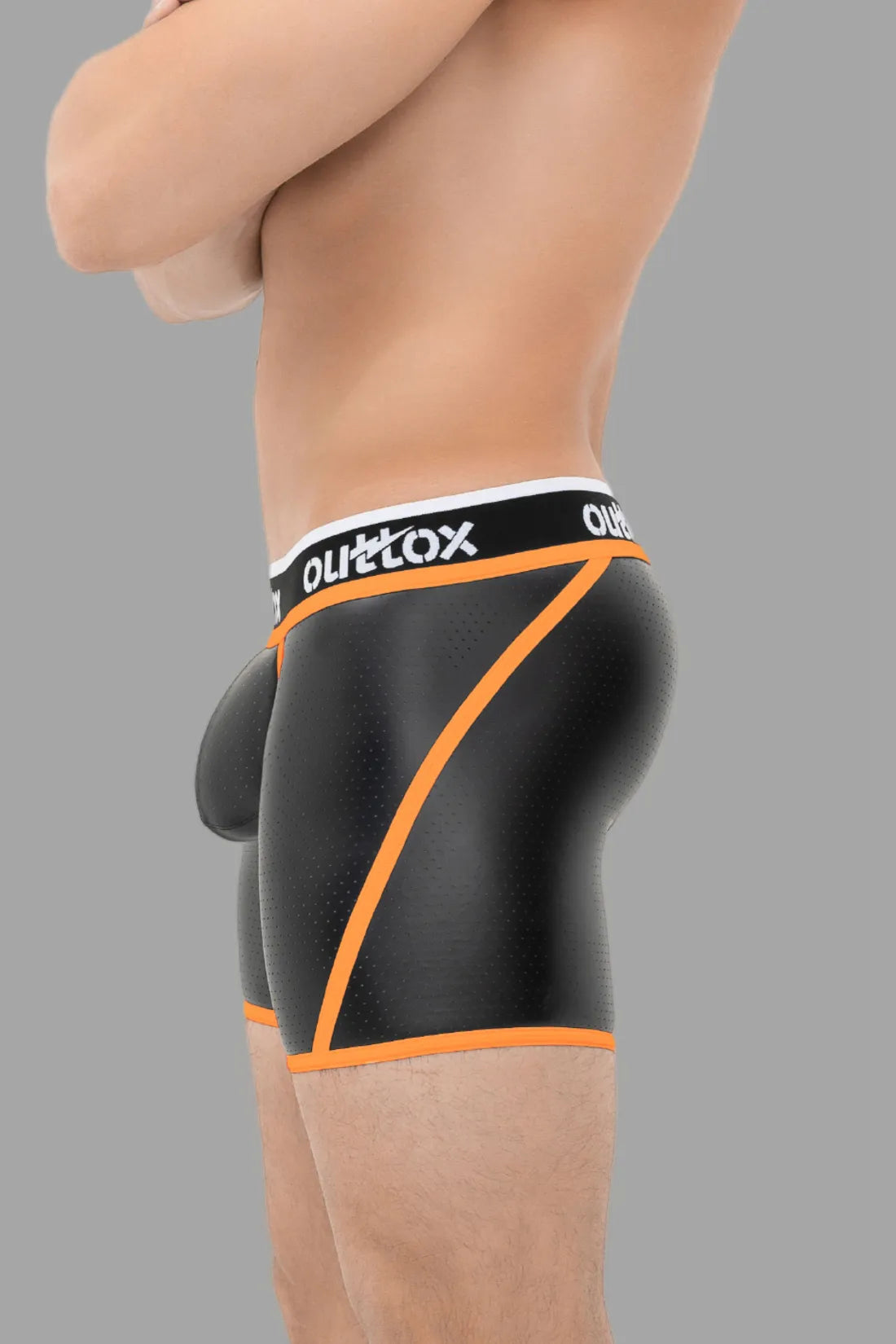 Outtox. Kurze Strumpfhose mit Wickel-Rücken. Schamkapsel mit Druckknopf. Schwarz und Orange