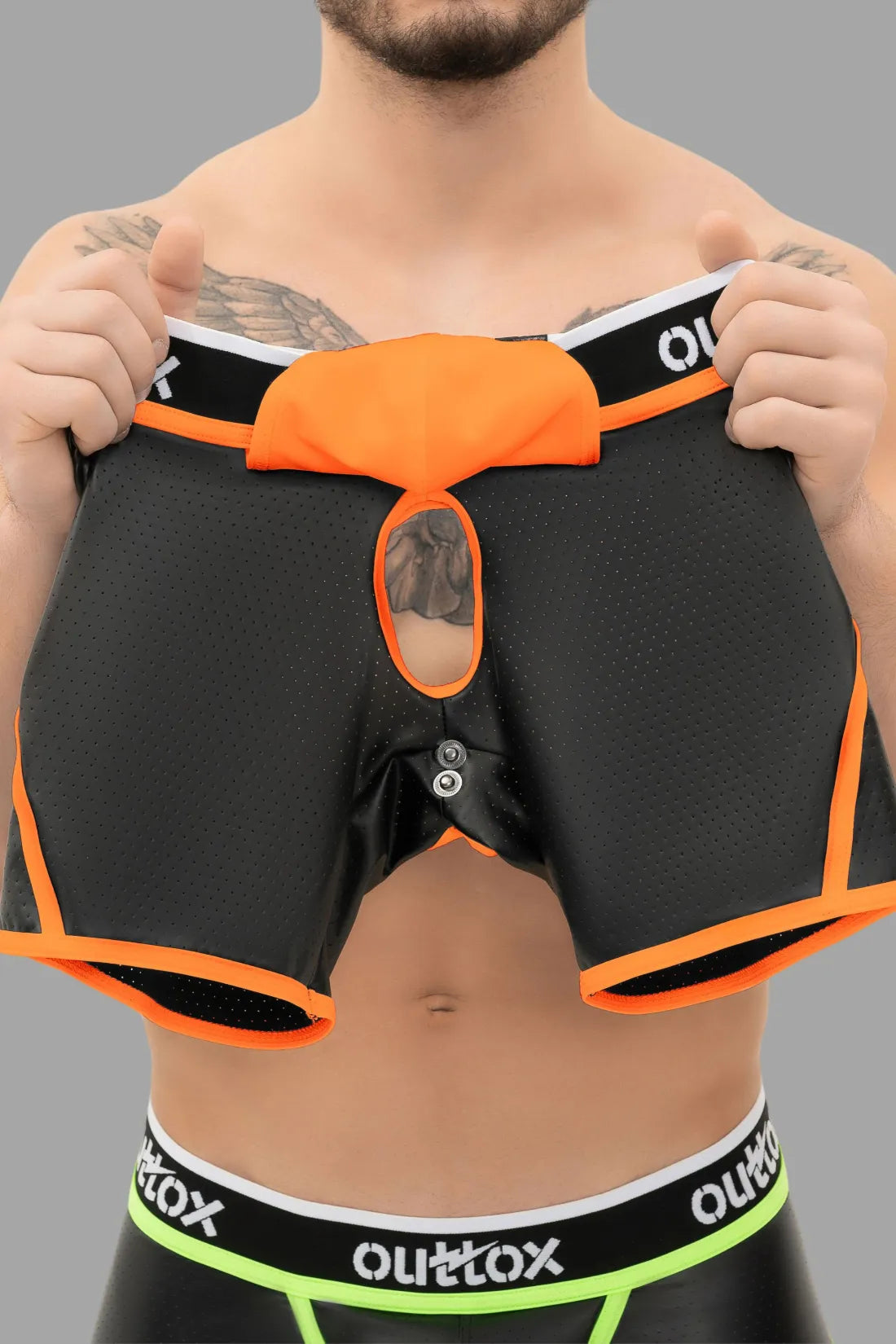 Outtox. Short arrière ouvert avec Snap Codpiece. Orange &