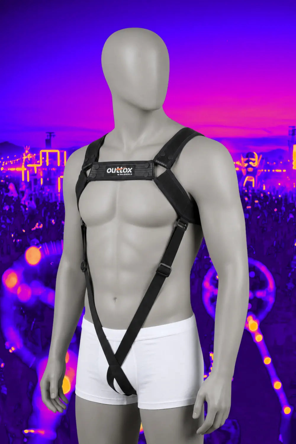 Outtox by Maskulo - Full Body Harness in black. Features stretch PU leather straps with sandwich technology, adjustable snap buttons, and visually slimming elastic front bands. Perfect for urban party-goers and clubwear.