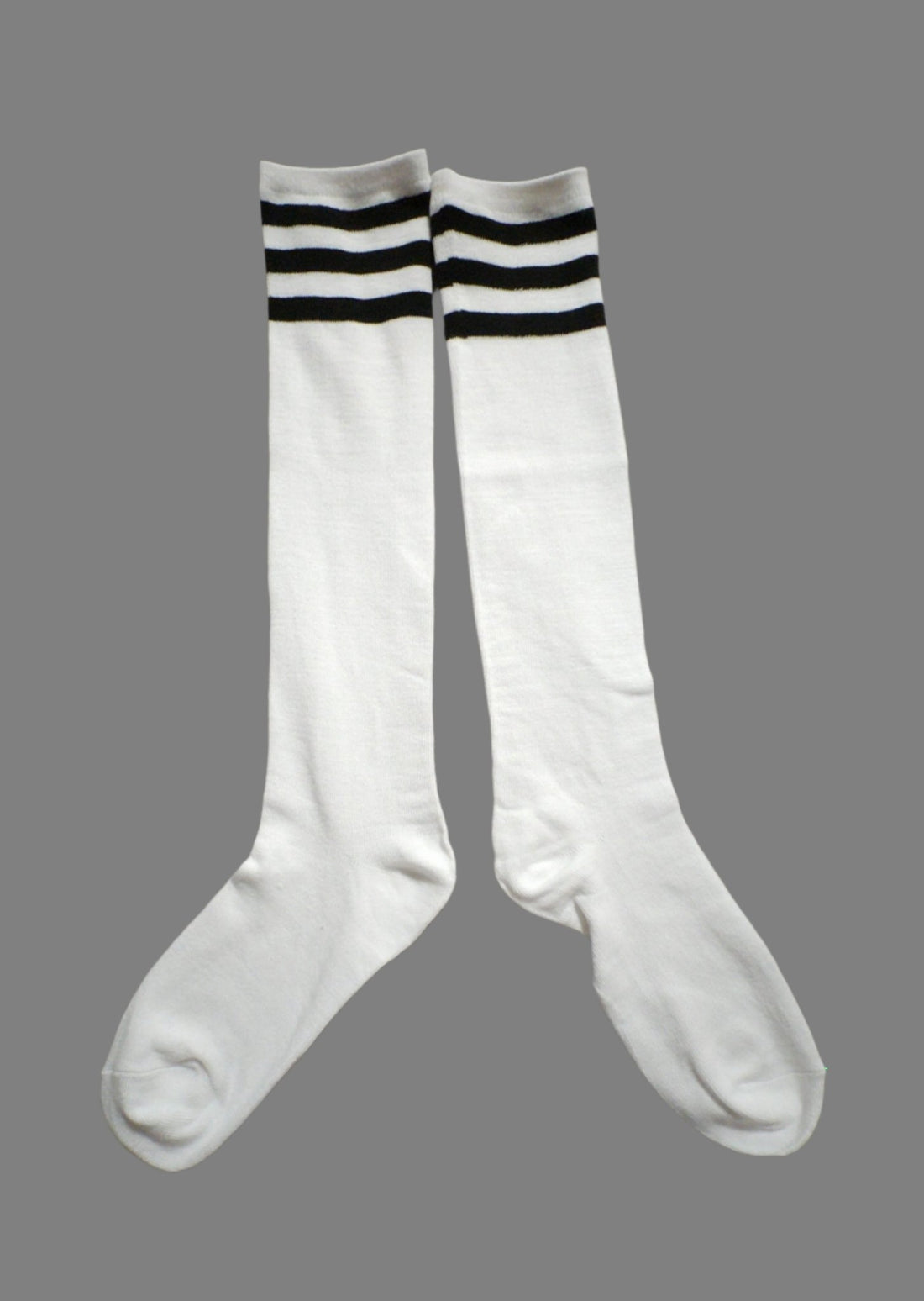 Maskulo Long Socks: White with Black Stripes. Polyester and cotton blend, stretchy, 45cm total length. Ideal for football and running.