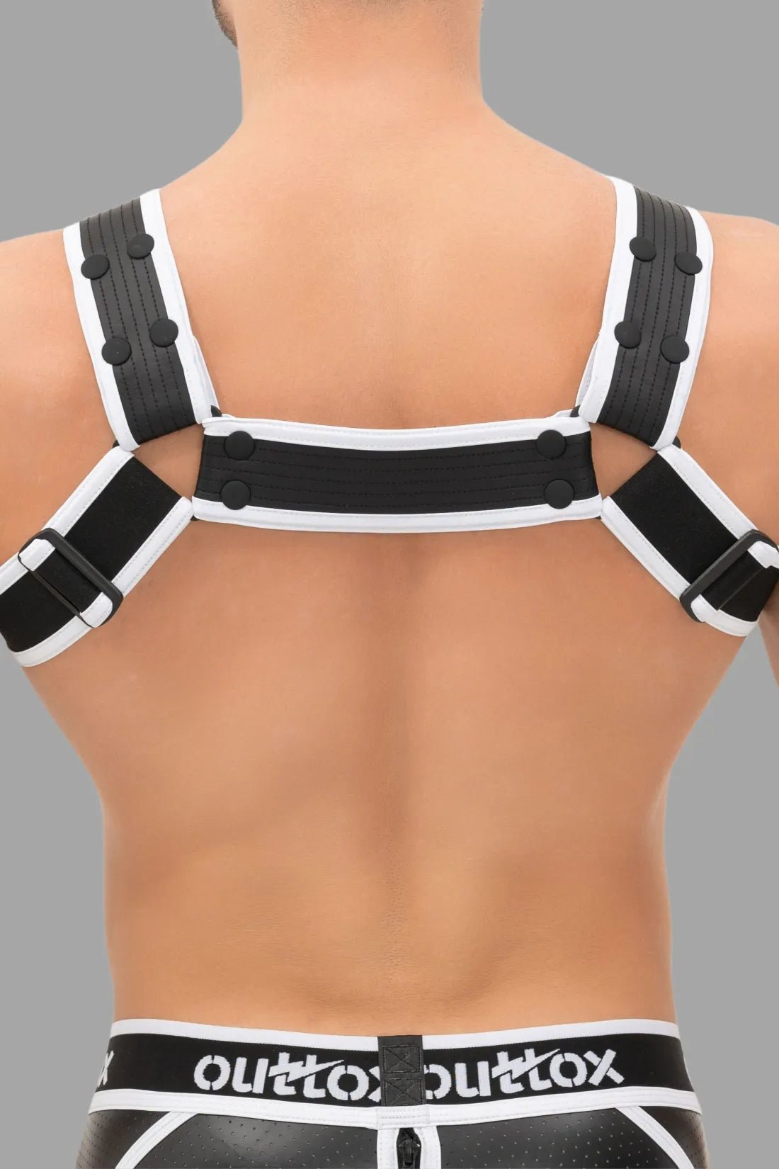 Black and white Outtox Bulldog Harness with snaps from Maskulo Global store, accessory for a bold look.