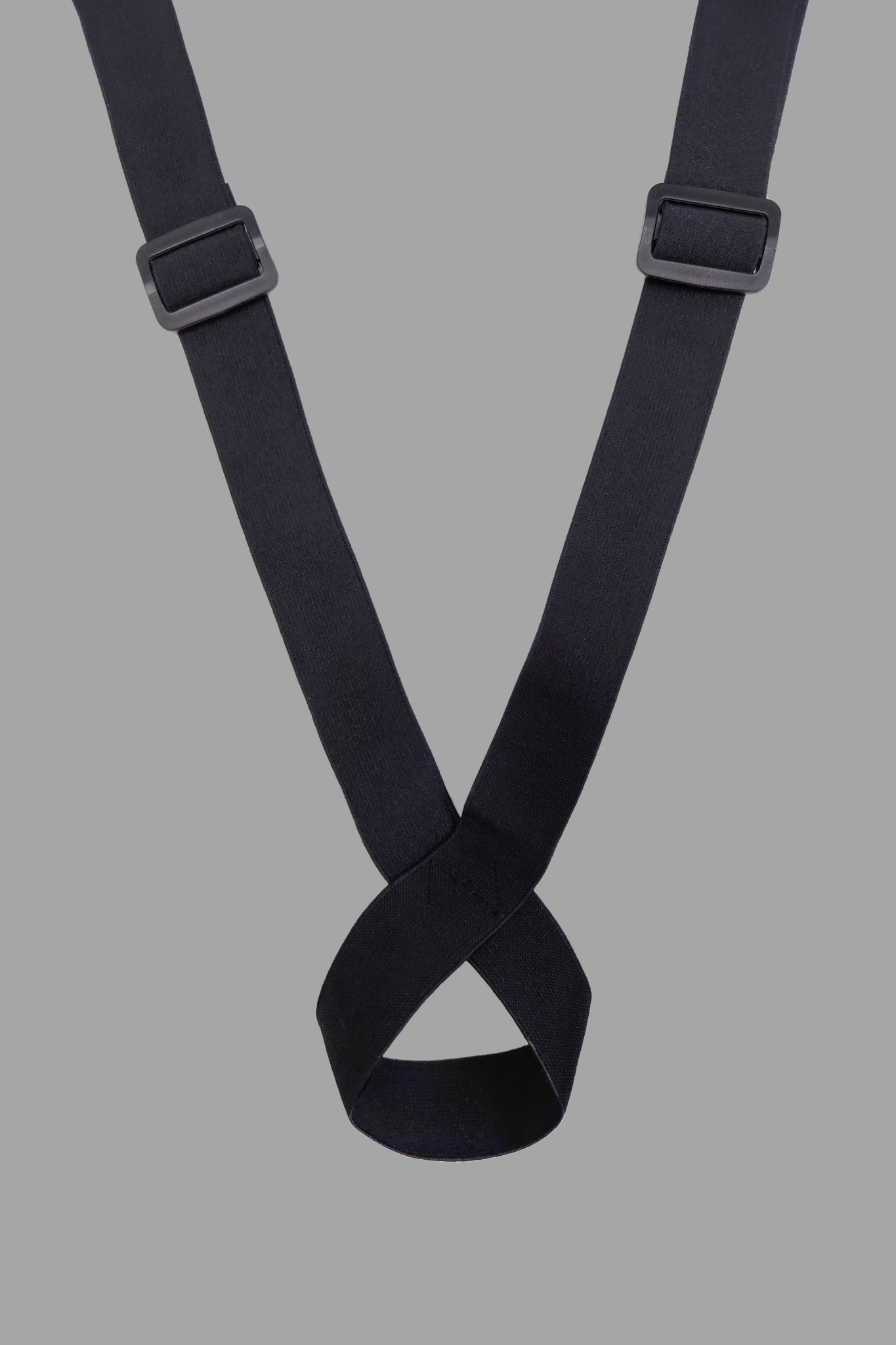 Outtox Body Harness with Snaps in Black and Orange. Leather-look adjustable accessory from Maskulo for a striking look.