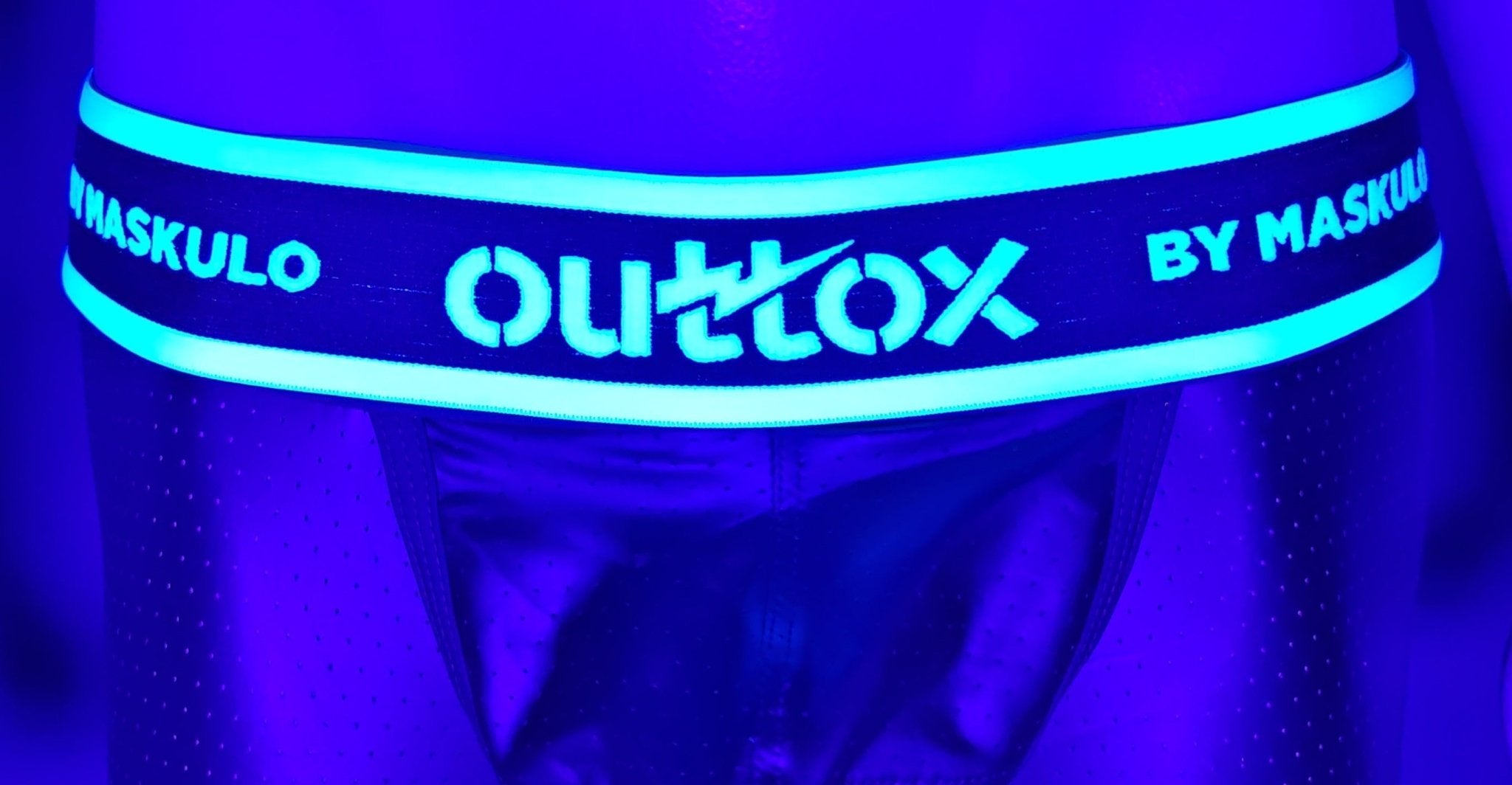 Maskulo Outtox open rear trunk shorts with snap codpiece in black, back view. Men&